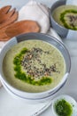 Healthy creamy soup with fresh ramson or wild garlic leaves