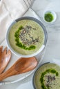 Healthy creamy soup with fresh ramson or wild garlic leaves