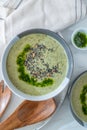 Healthy creamy soup with fresh ramson or wild garlic leaves