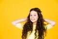 Healthy curls. Easy hairdo. Beauty supplies. Perfectly untangle curly hair. Pretty girl curly hair yellow background