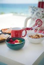 Healthy and delicious breakfast on the balcony with beautiful ocean view. Coffee time. Vacation by the sea. Royalty Free Stock Photo