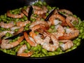 Healthy and delicious diet meal with shrimps, edamame beans and chili, served in a cast iron pot
