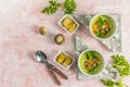 Healthy delicious potato cauliflower soup puree with carrot chips and croutons on a pink background, top view Royalty Free Stock Photo