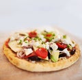 Healthy and delicious. A tasty pita bread topped with a range of fresh ingredients.
