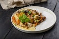 Healthy and delicious vegetarian food. Baked potatoes, carrots, green peas, chanterelles with mozzarella cheese. Edible forest