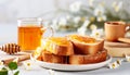 healthy and delightful breakfast featuring honey drizzled on toast and a steaming cup of tea.