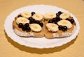 Dark bread with peanut butter, black currant and banana slices Royalty Free Stock Photo