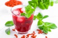 Healthy detox drink with goji berries infused in water with ice, cold refreshing beverage close-up Royalty Free Stock Photo