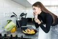 Healthy Diet. Beautiful Smiling Woman Eating Fresh Organic Vegetarian Salad In Modern Kitchen. Healthy Eating, Food And Lifestyle Royalty Free Stock Photo