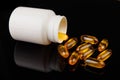 Healthy diet concept. Fish oil capsules with omega 3 and vitamin D in a plastic bottle on a black background.