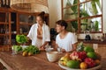 Healthy Diet. Couple Cooking Vegetable Salad At Kitchen In Tropical Villa. Cheerful Woman And Handsome Man.