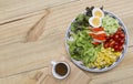 Healthy and diet food concept, fresh mixed vegetable with boil egg and crab stick salad with Japanese dressing Royalty Free Stock Photo