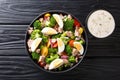 Healthy diet food salad with tuna, broccoli, tomatoes, onions and eggs close-up in a plate. Horizontal top view Royalty Free Stock Photo