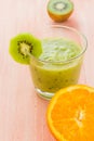 Healthy diet fruit juice kiwi orange wooden table Royalty Free Stock Photo