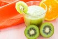 Healthy diet fruit juice kiwi orange wooden table Royalty Free Stock Photo