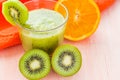 Healthy diet fruit juice kiwi orange wooden table Royalty Free Stock Photo