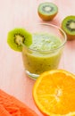 Healthy diet fruit juice kiwi orange wooden table Royalty Free Stock Photo