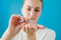 Healthy Diet Nutrition. Portrait Of Beautiful Smiling Young Woman Taking Vitamin Pill. Closeup Of Happy Girl Holding Colorful Royalty Free Stock Photo