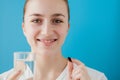 Healthy Diet Nutrition. Portrait Of Beautiful Smiling Young Woman Taking Vitamin Pill. Closeup Of Happy Girl Holding Colorful Royalty Free Stock Photo