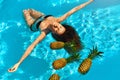 Healthy Diet, Nutrition. Woman With Pineapples In Pool ( Water ) Royalty Free Stock Photo