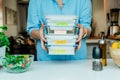 Healthy diet plan for weight loss, daily ready meal menu. Woman holding lunch boxes just cooked in advance, ready to be Royalty Free Stock Photo