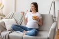 Healthy Diet During Pregnancy. Young expectant woman enjoying fresh vegetable salad Royalty Free Stock Photo