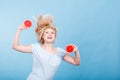 Woman holding red grapefruit having crazy windblown hair Royalty Free Stock Photo