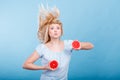 Woman holding red grapefruit having crazy windblown hair Royalty Free Stock Photo