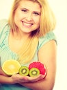 Woman holding fruits kiwi. orange, lemon and grapefruit Royalty Free Stock Photo