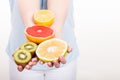 Woman holding fruits kiwi. orange, lemon and grapefruit Royalty Free Stock Photo