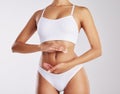 A healthy diet shows on the outside. a woman forming a frame over her stomach. Royalty Free Stock Photo