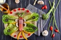 Healthy dietary breakfast vegetables on a plate - leaves of khasa, cherry tomatoes, paprika, esparagus, olives laid out in the Royalty Free Stock Photo