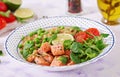 Slices of grilled salmon, quinoa, green peas, tomato, lime and lettuce leaves Royalty Free Stock Photo