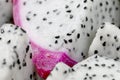 Healthy dragon fruit or pitaya pieces background, close up of beautiful fresh sliced dragon fruit with texture in the market in Royalty Free Stock Photo