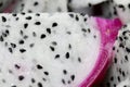 Healthy dragon fruit or pitaya pieces background, close up of beautiful fresh sliced dragon fruit with texture in the market in Royalty Free Stock Photo