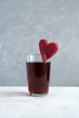 Healthy drink with beetroot juice. Glass of red beverage decorated slice of beet heart shaped. Salgam. Fermented homemade drinks Royalty Free Stock Photo