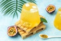 Healthy drink glass of Iced passion fruit soda in a light sunny background, Tropical drink for summer party Royalty Free Stock Photo