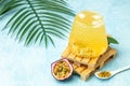 healthy drink glass of Iced passion fruit soda in a light sunny background, Tropical drink for summer party Royalty Free Stock Photo