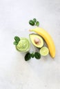 Smoothies with banana, avocado, spinach, lime