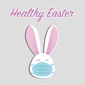 Healthy Easter concept. Cute Easter bunny in face mask on grey background with text. Stay home stay safe. Vector in flat style. Royalty Free Stock Photo