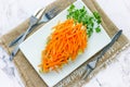 Healthy Easter appetizer salad decorated with fresh carrot and green parsley