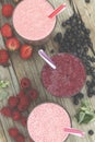 Appetizing smoothies and detox drinks from ripe berries. Raspberries, strawberries, blueberries. Healthy eating. Royalty Free Stock Photo