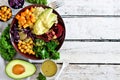 Healthy eating Buddha bowl on white wood. Top view, side border with copy space. Royalty Free Stock Photo