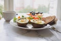 Healthy eating concept Baked avocado with quail eggs