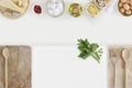 Healthy eating concept with cutting boards and cooking ingredients on kitchen white worktop, copy space, top view Royalty Free Stock Photo