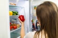 Healthy eating concept. Diet. Beautiful young woman near the refrigerator with healthy food. Fruits and vegetables in a Fridge Royalty Free Stock Photo