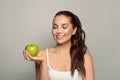 Healthy eating concept. Perfect brunette woman with a green apple Royalty Free Stock Photo