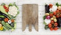 Healthy eating concept wooden cutting board with basket full of Royalty Free Stock Photo