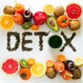 Healthy eating concept. Word `detox` from green tea with colorful smoothies and fruits