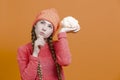 Healthy Eating Concepts. Thinking Caucasian Girl In Coral Knitted Clothing Posing With Cauliflower as a Demonstration of Human Royalty Free Stock Photo